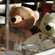Giant teddy bears seated at restaurant table